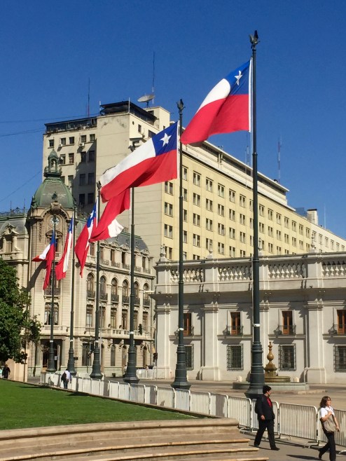 Photo of flags at La Moneda in Santiago, Chile